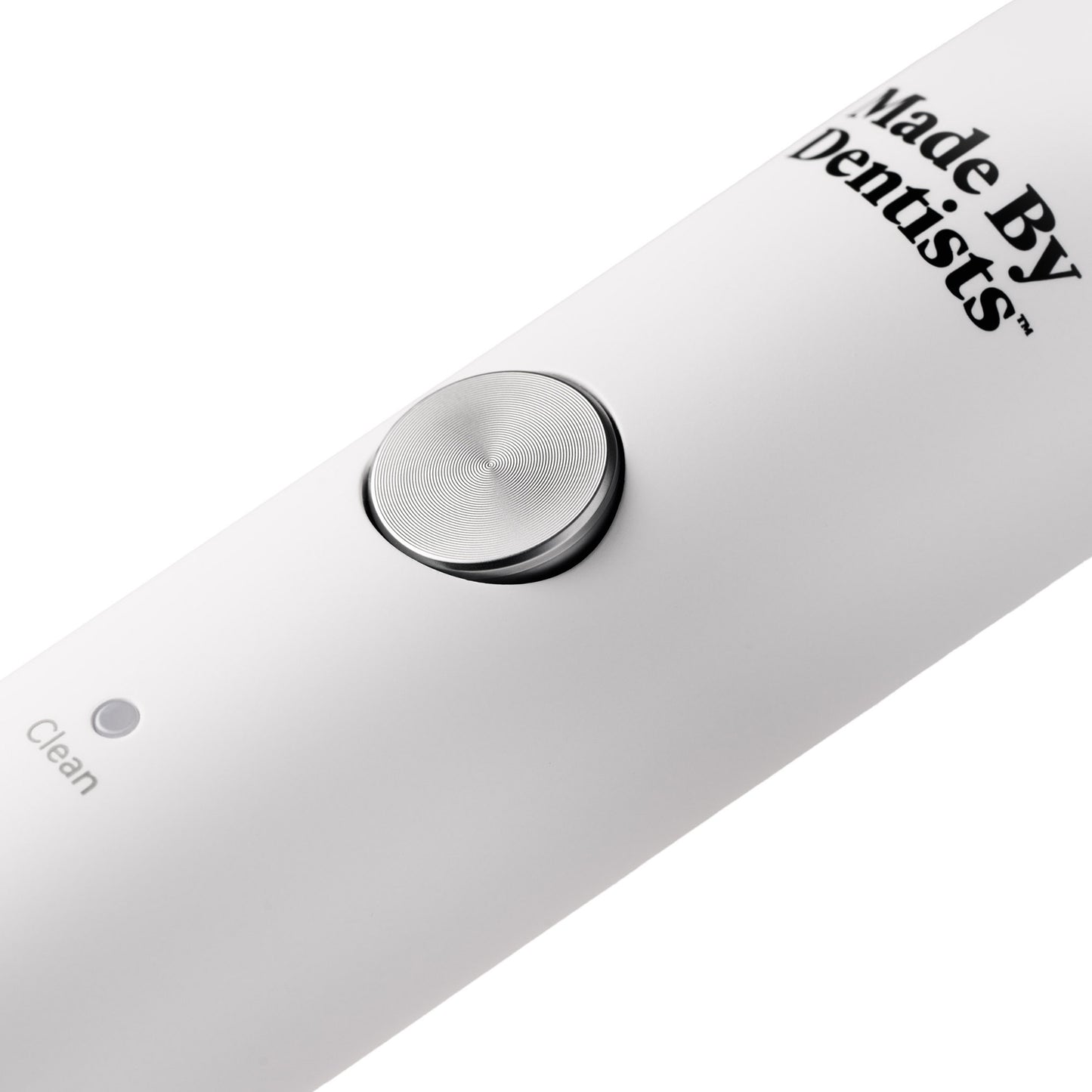 Close-up of the power button on the white Sonic Toothbrush