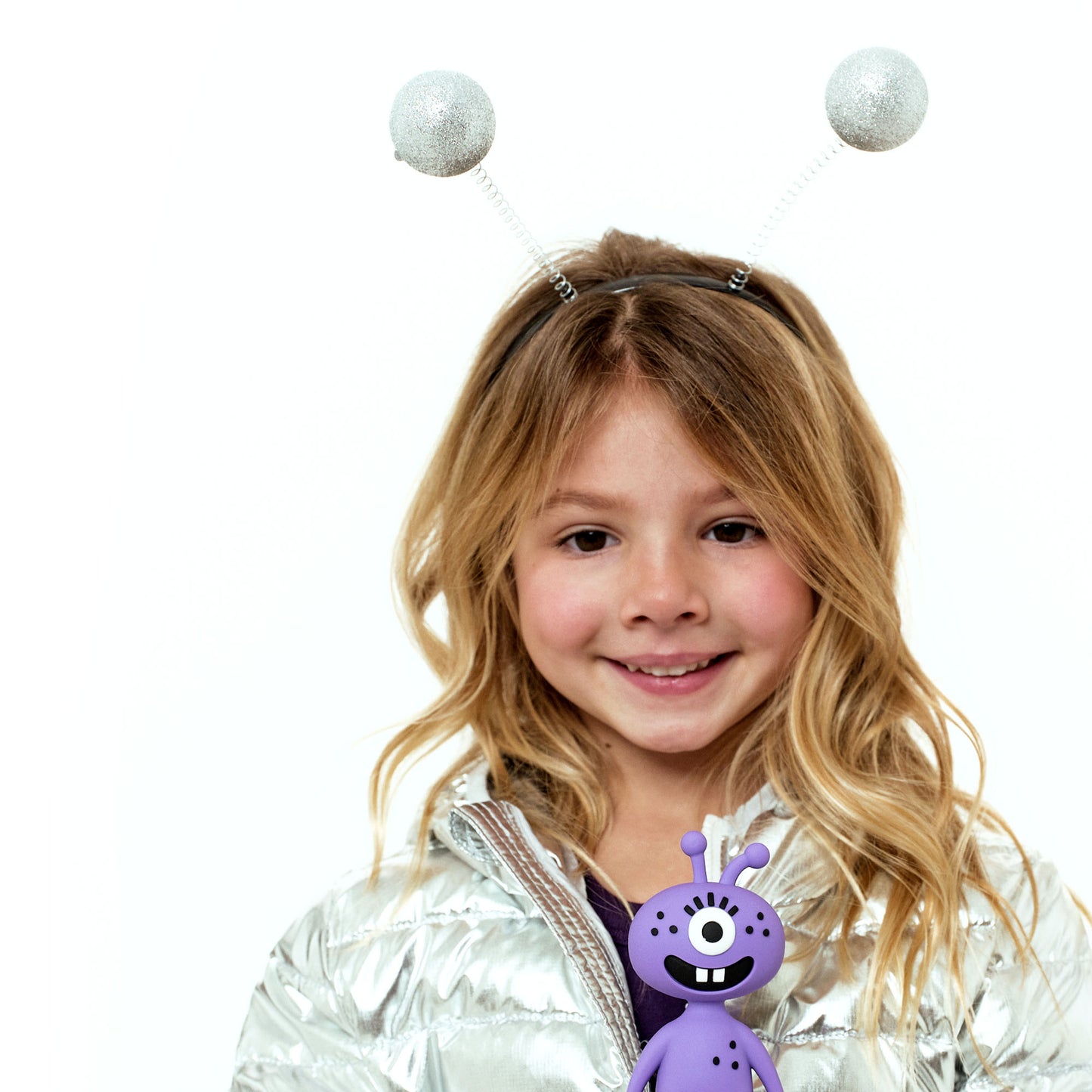 Girl smiling holding the Luna vinyl figure
